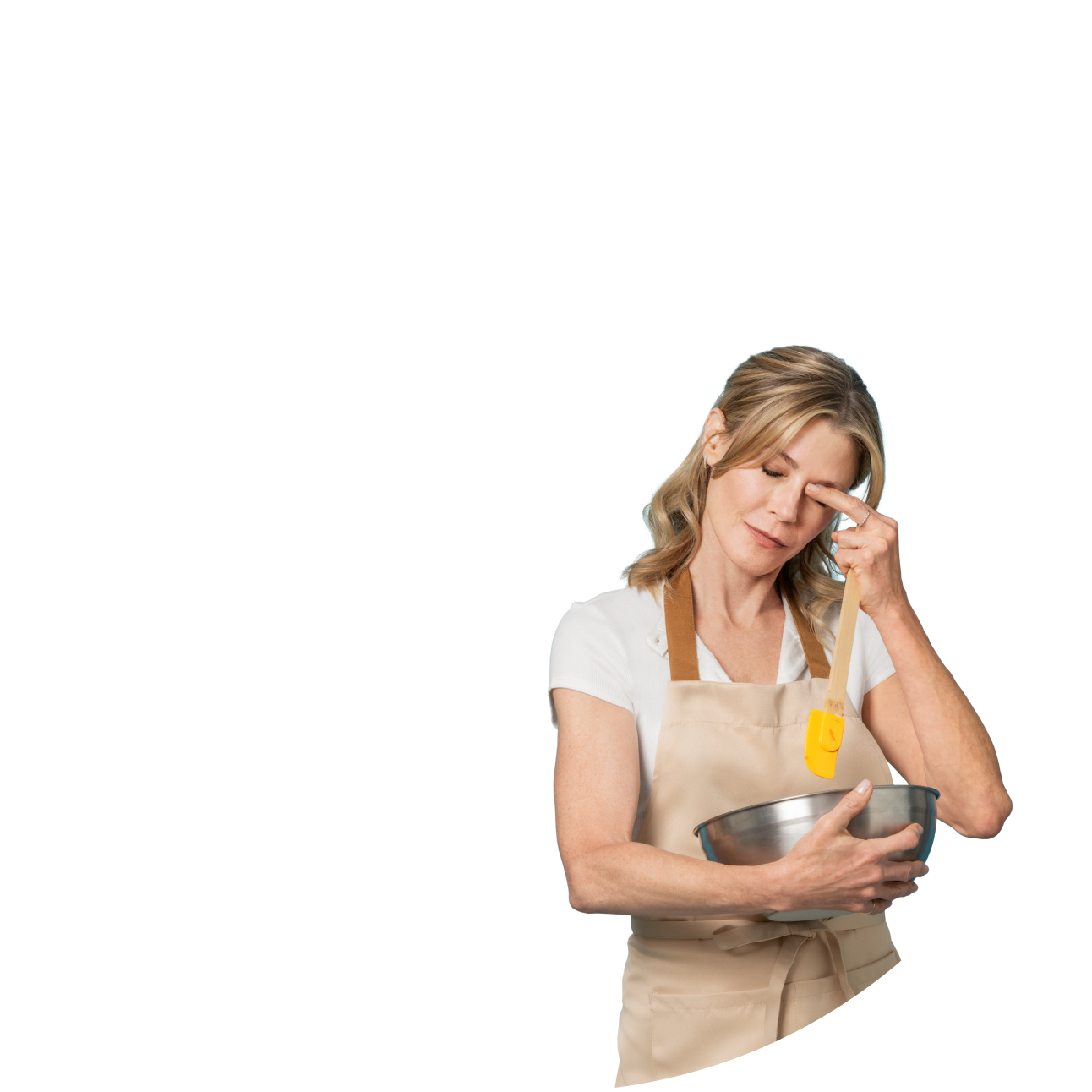 White woman with itchy eyes in an apron holding a mixing bowl